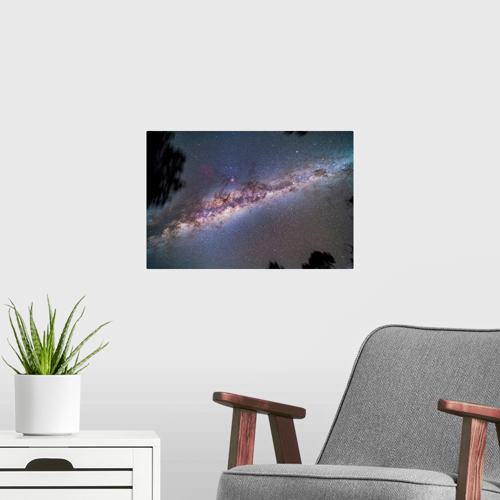 A modern room featuring A view looking up to the zenith at the centre of the Milky Way galaxy.