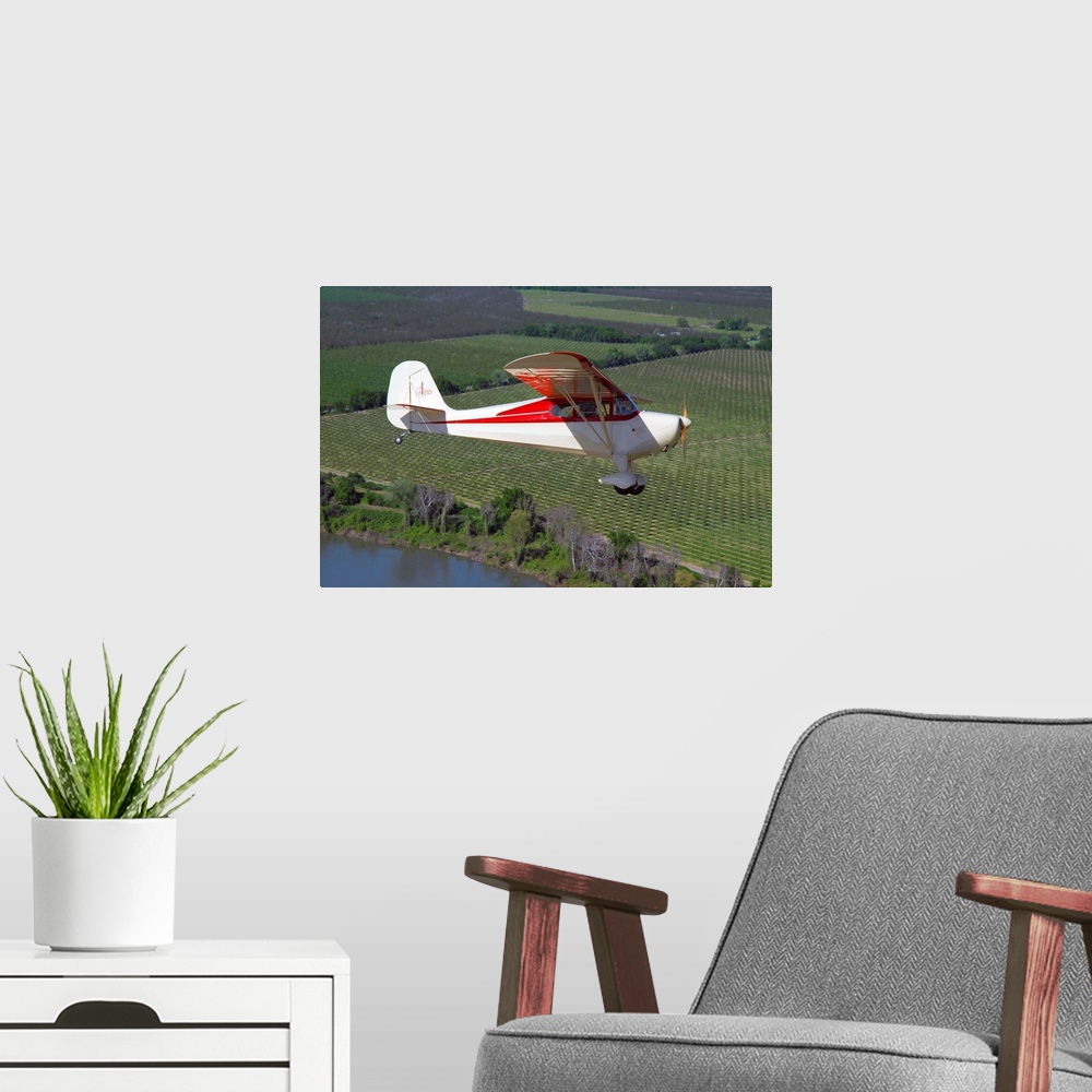 A modern room featuring Aeronca Chief flying over Sacramento Valley, California..