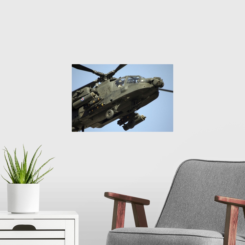 A modern room featuring An AH64 Apache in flight over the Baghdad Hotel in central Baghdad Iraq