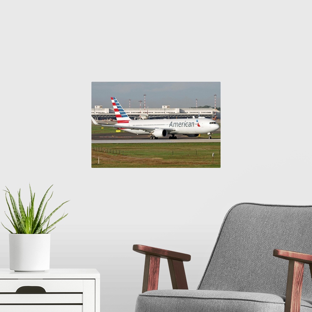 A modern room featuring An American Airlines Boeing 767 at Milano Malpensa Airport, Italy.