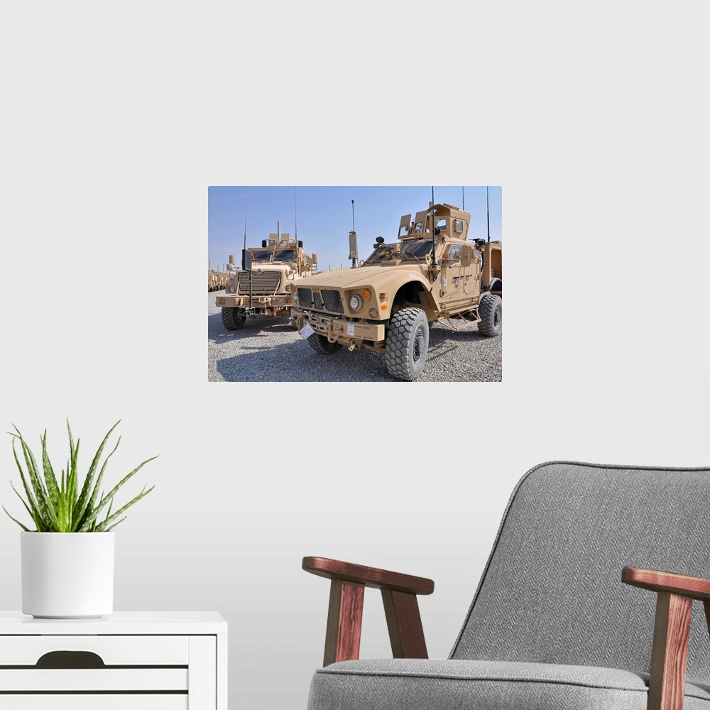 A modern room featuring October 22, 2009 - A Mine Resistant Ambush Protected all-terrain vehicle (M-ATV), right, is parke...