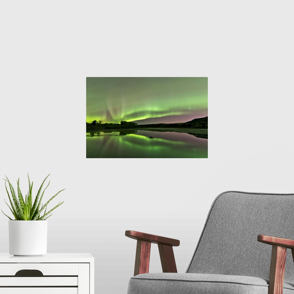 A modern room featuring Aurora borealis over Fish Lake, Whitehorse, Yukon, Canada.