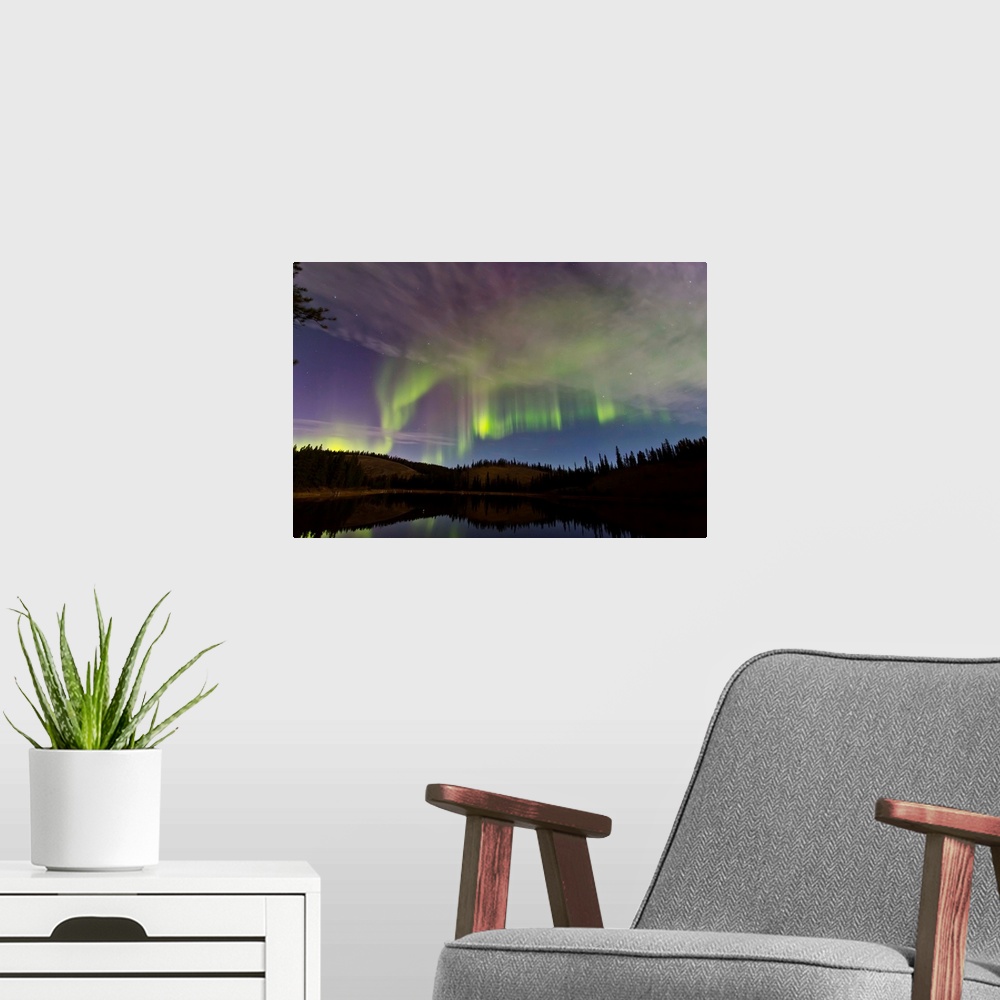 A modern room featuring Aurora borealis over Hidden Lake, Yukon, Canada.