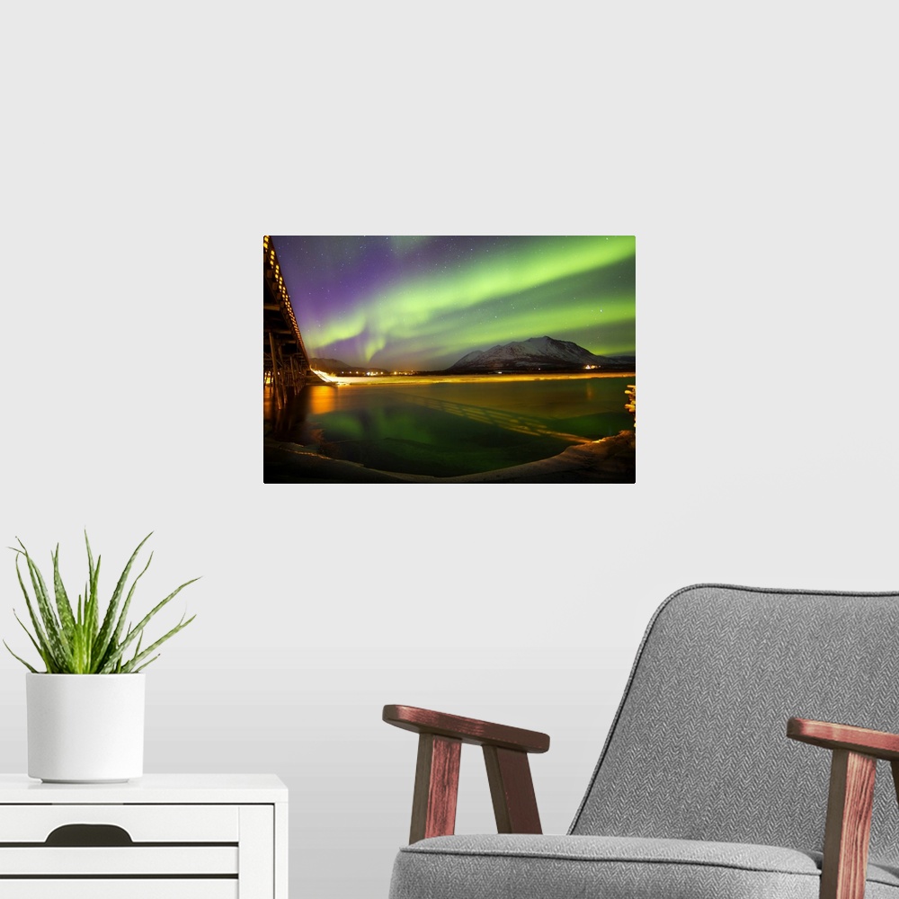 A modern room featuring Aurora borealis over Nares Lake, Carcross, Yukon, Canada.