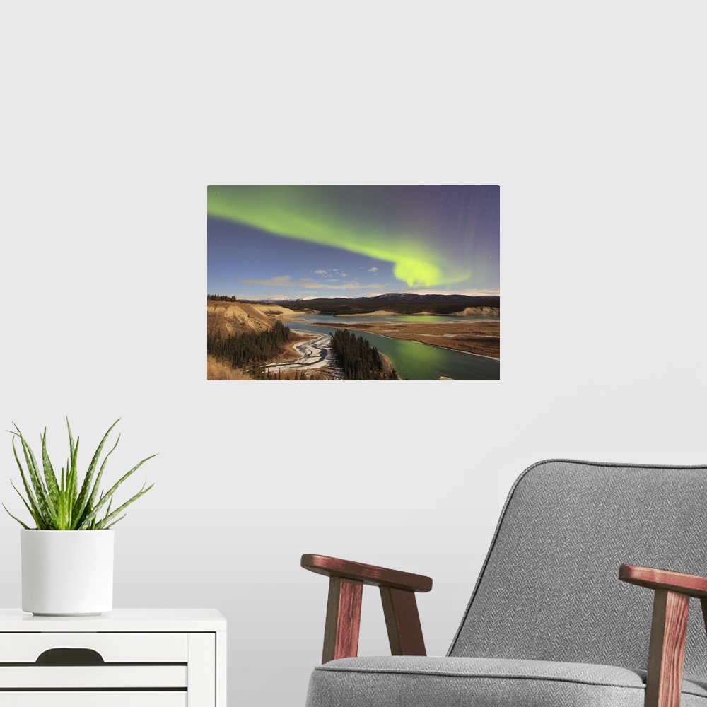 A modern room featuring Aurora borealis over the Yukon River, Whitehorse, Yukon, Canada.