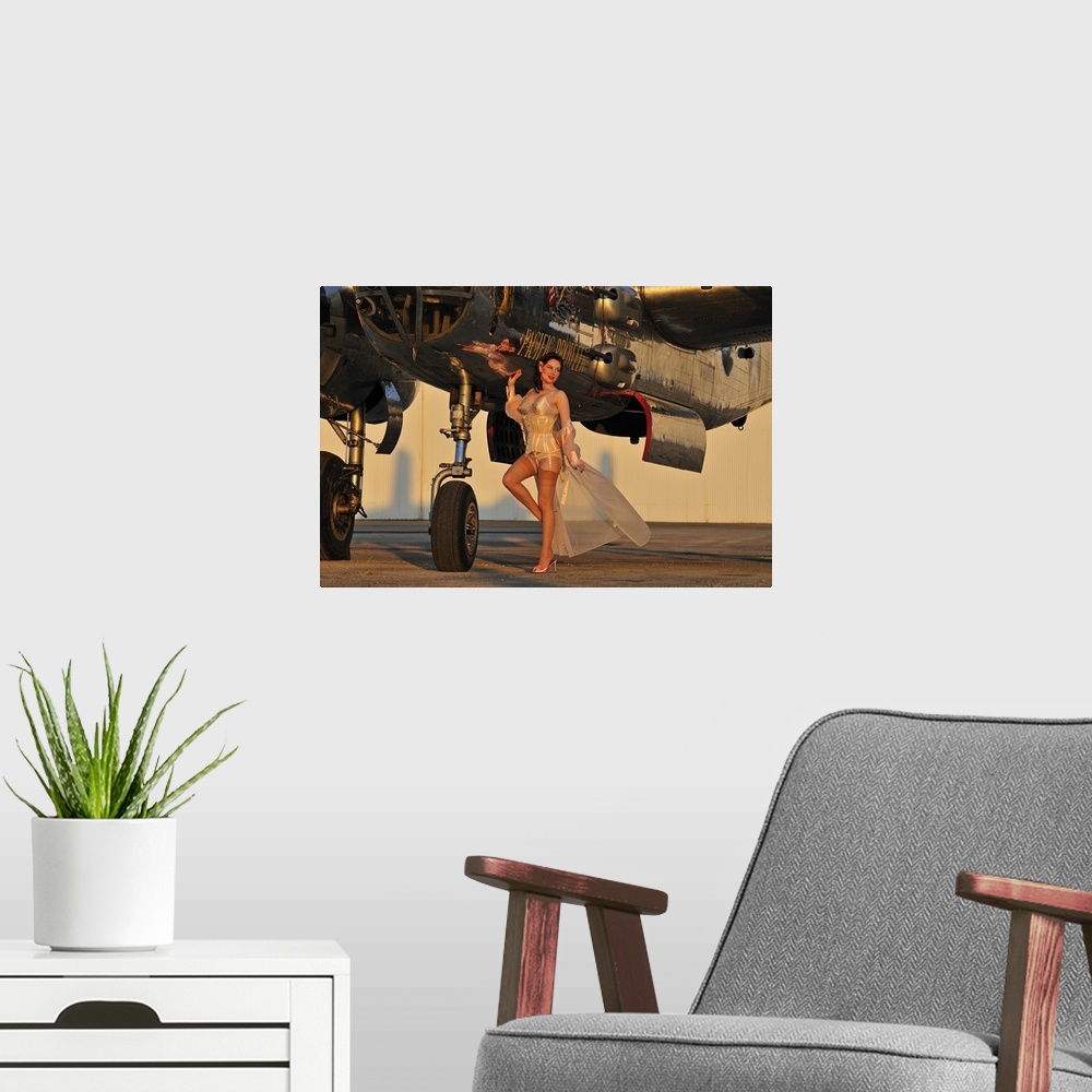 A modern room featuring Beautiful 1940's pin-up girl standing with a B-25 bomber.