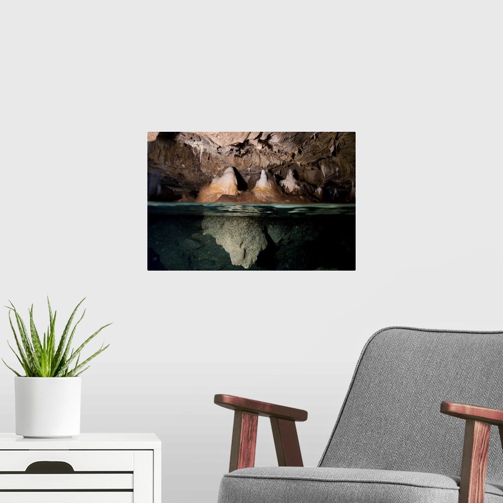 A modern room featuring Split shot of stalactites and stalagmites in a cave, Australia.