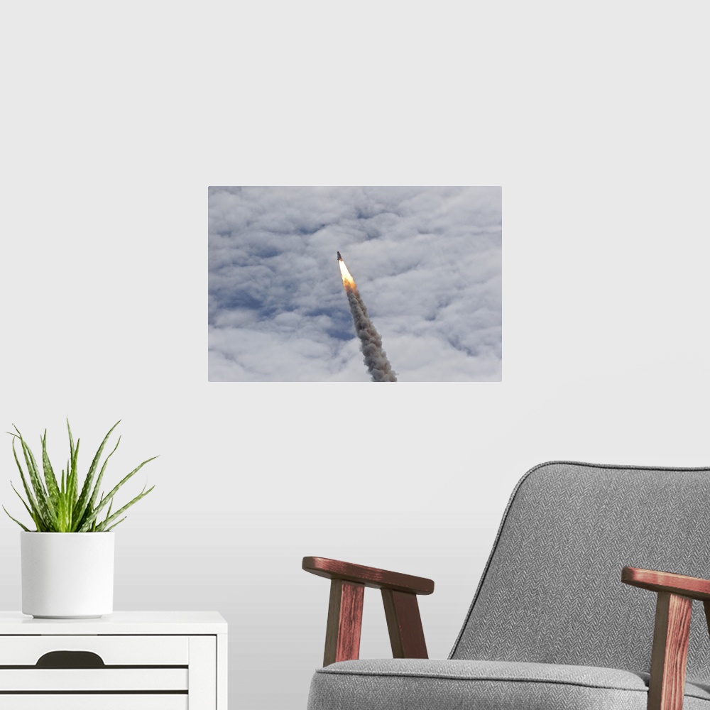 A modern room featuring July 8, 2011 - Space shuttle Atlantis just before it disappears into the clouds, Cape Canaveral, ...