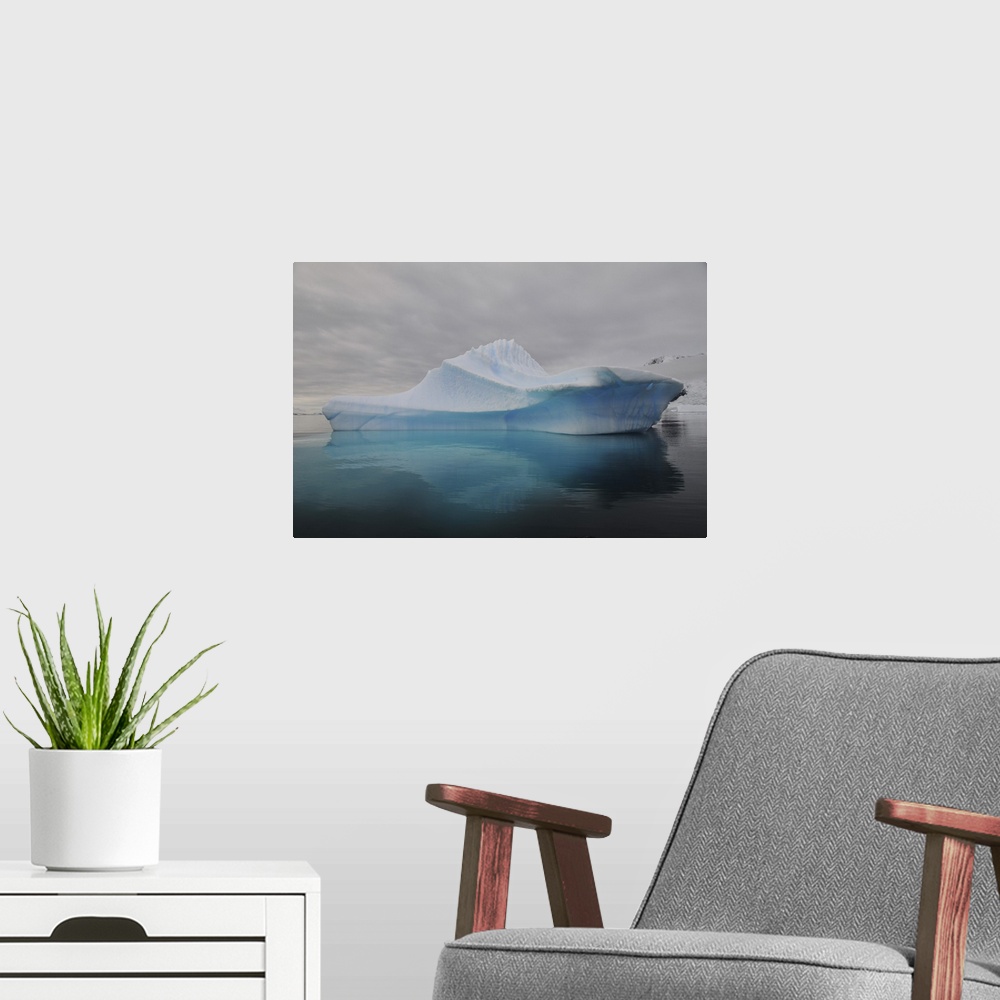 A modern room featuring Translucent blue iceberg reflection, Antarctica.