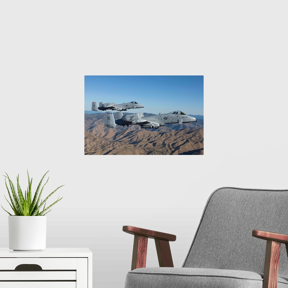 A modern room featuring Two A-10 Thunderbolt's from the 124th Fighter Wing's 190th Fighter Squadron fly over Central Idaho.