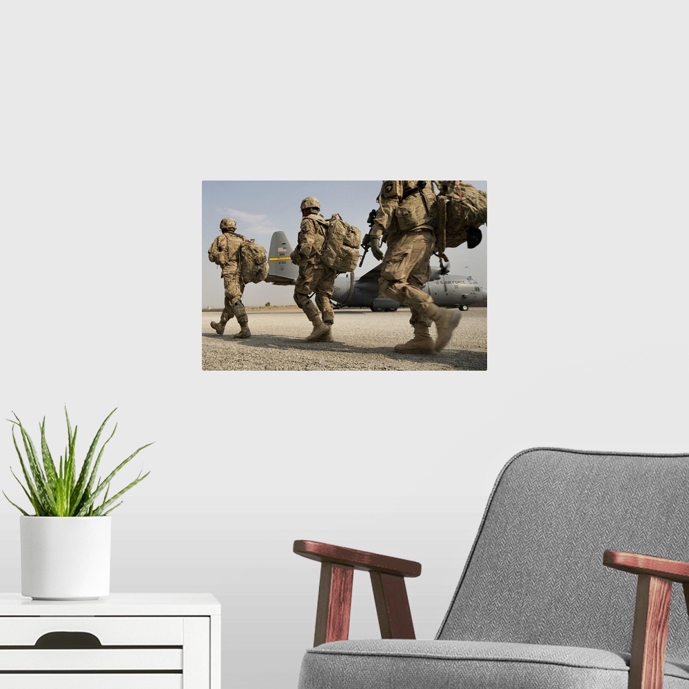 A modern room featuring September 23, 2013 - Army 101st Airborne Division Soldiers make their way to a 774th Expeditionar...