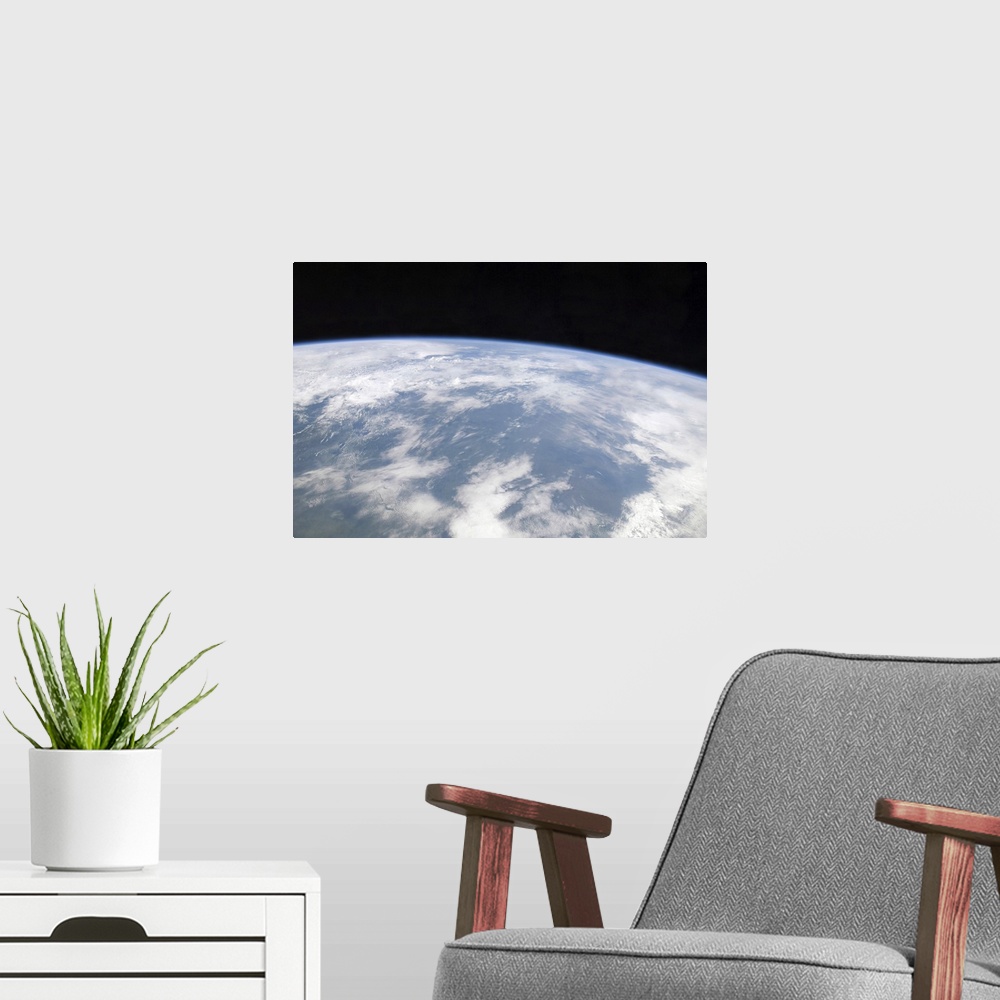 A modern room featuring View of planet Earth from space
