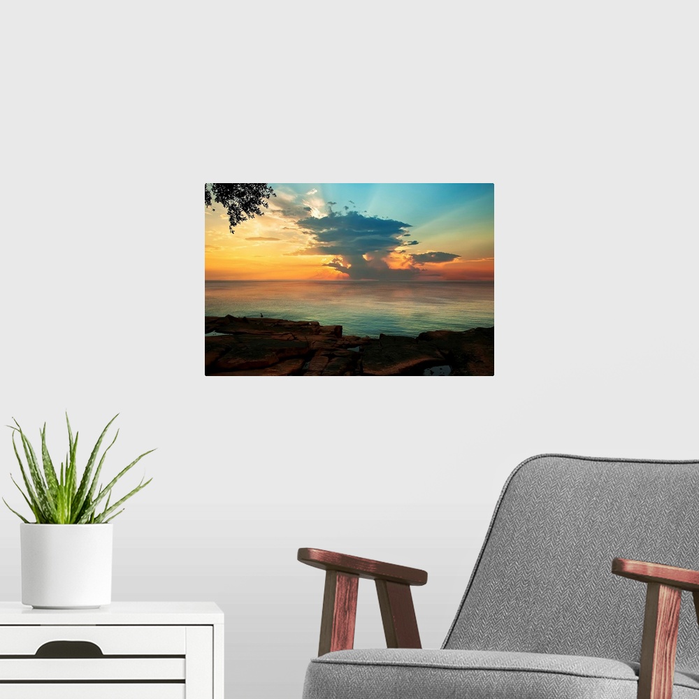 A modern room featuring Contemporary painting of the sun on the horizon, seen from across the water.