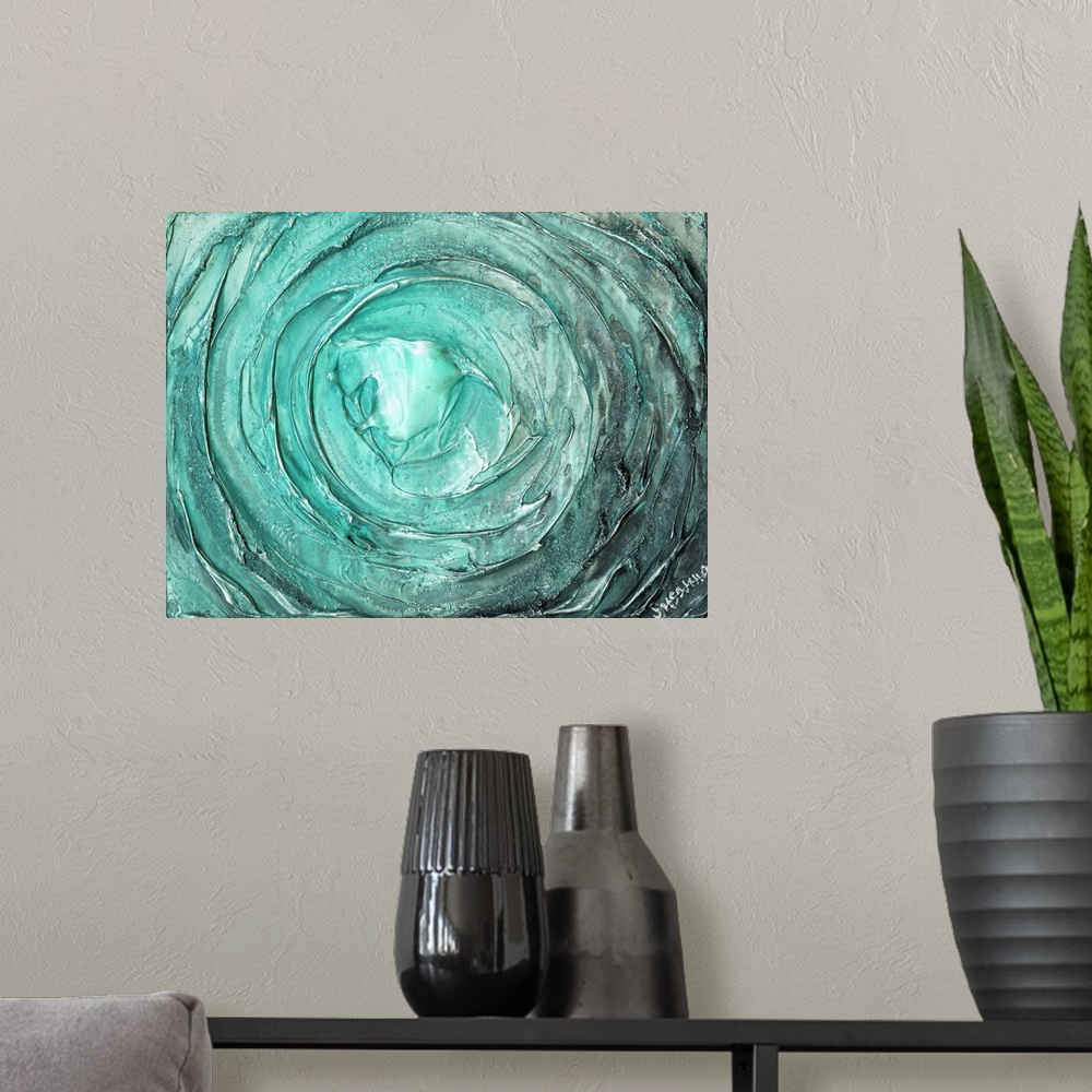 A modern room featuring Large abstract painting with thick circular strokes and layers of paint in aqua and silver.