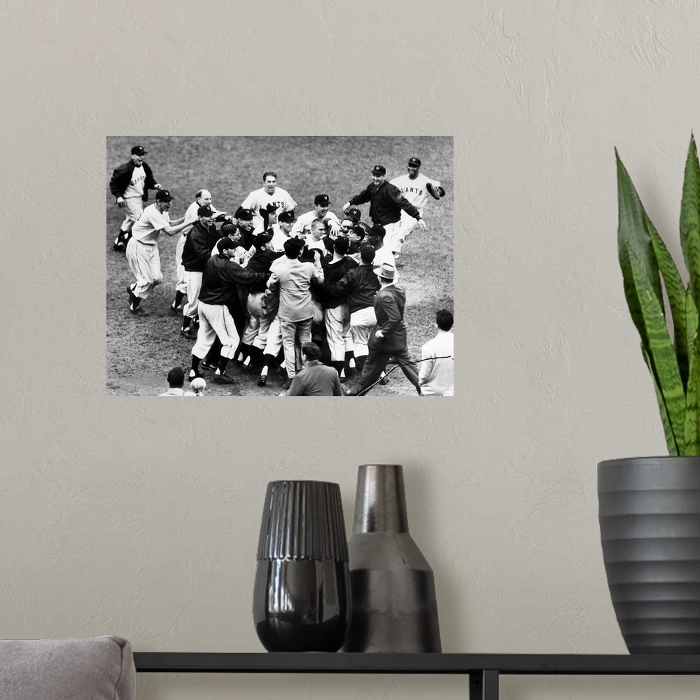 A modern room featuring Bobby Thomson of the New York Giants being mobbed by teammates and fans after hitting his pennant...