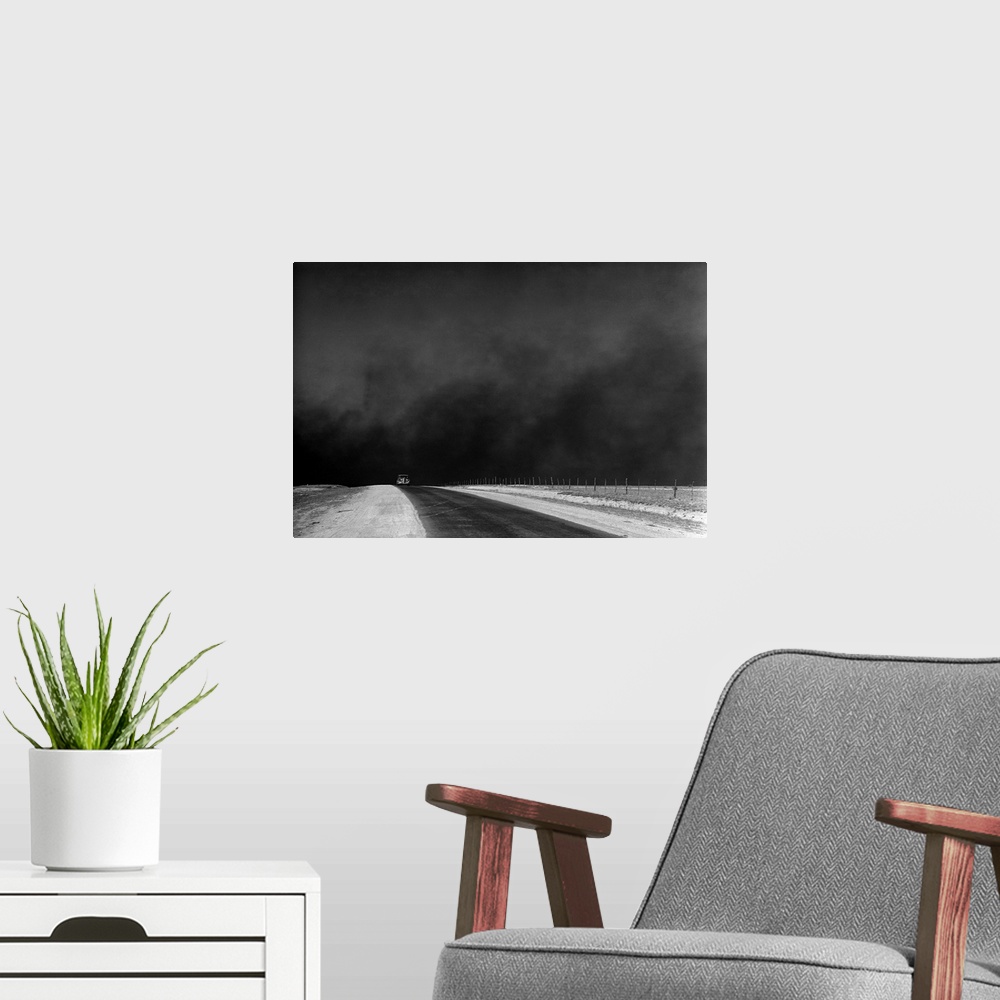 A modern room featuring A car on a deserted road with black clouds of dust rising from the horizon, Texas Panhandle, Texa...