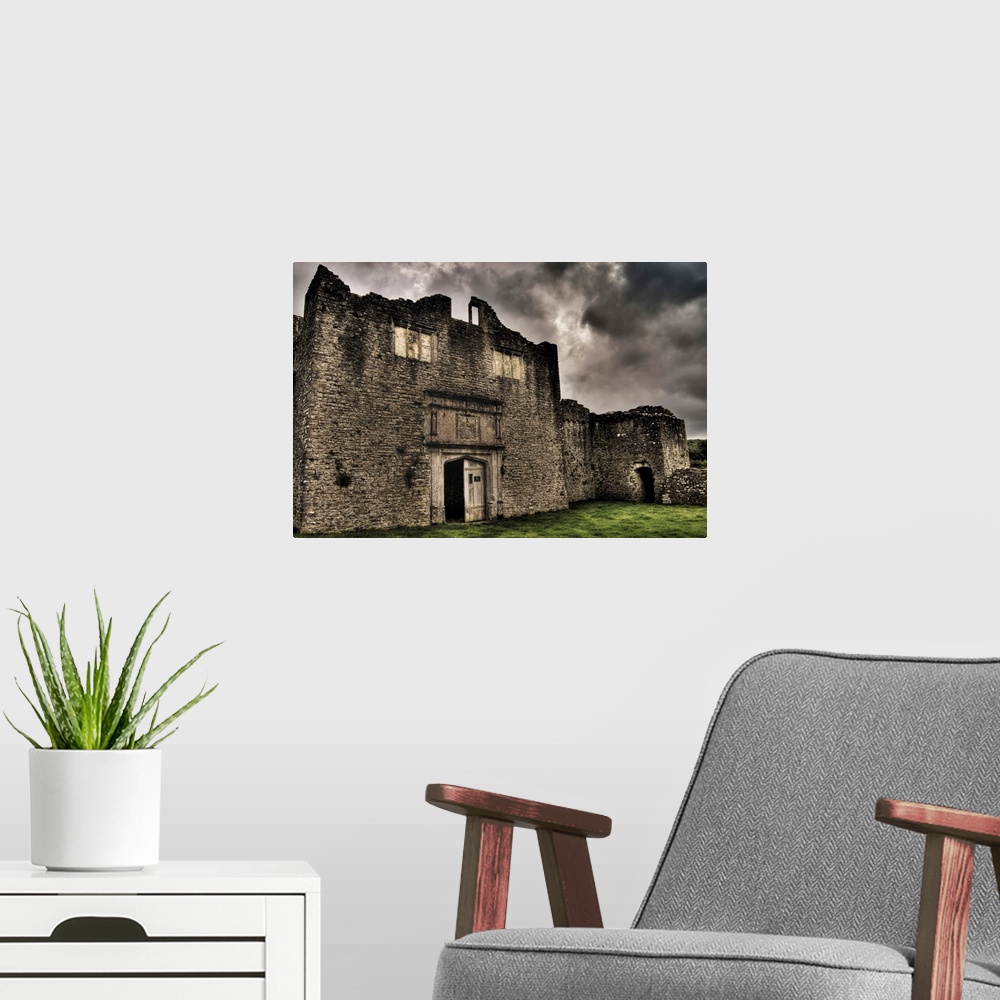 A modern room featuring Beaupre Castle medieval ruins in Wales.