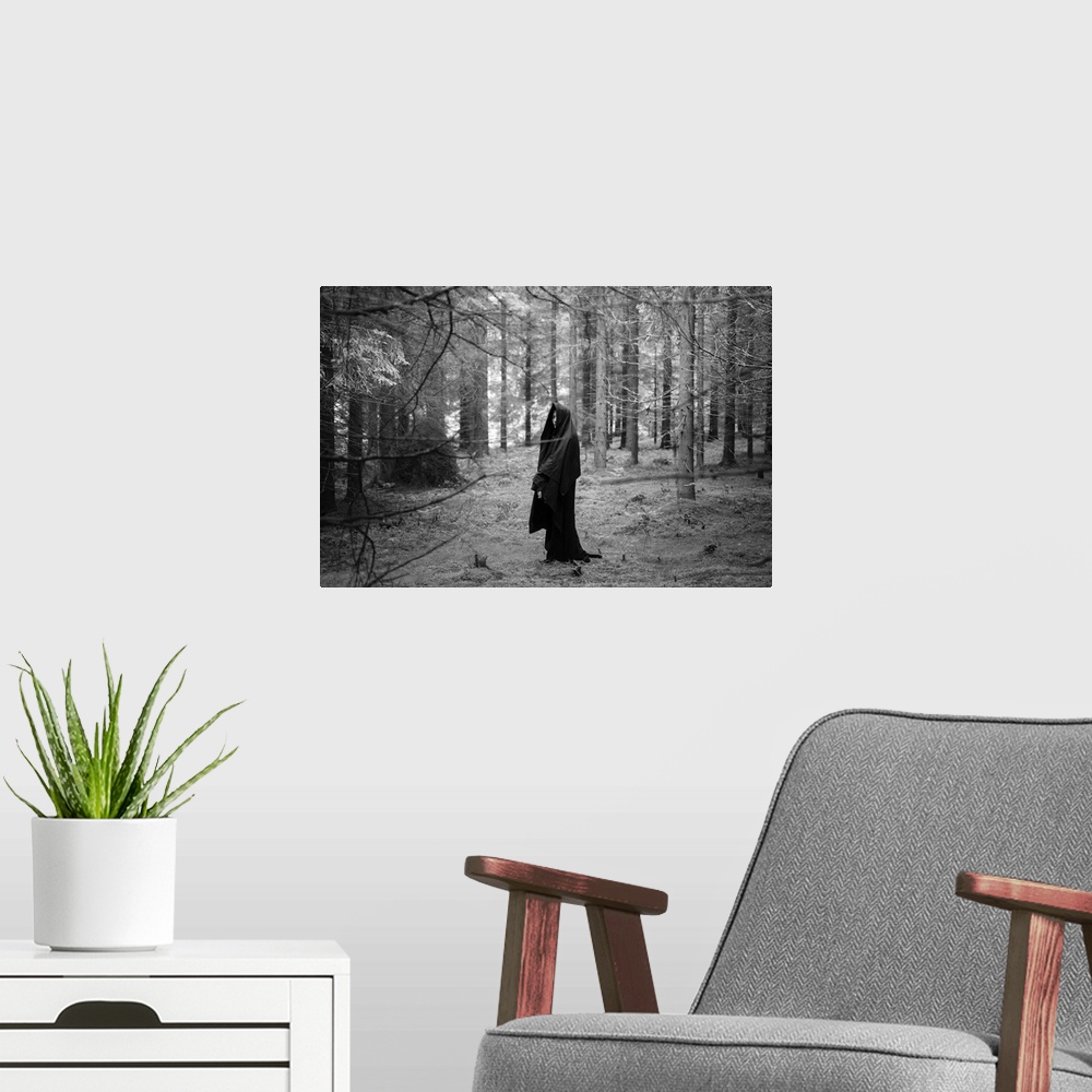 A modern room featuring Young adult female wearing veil standing alone in dark forest in winter