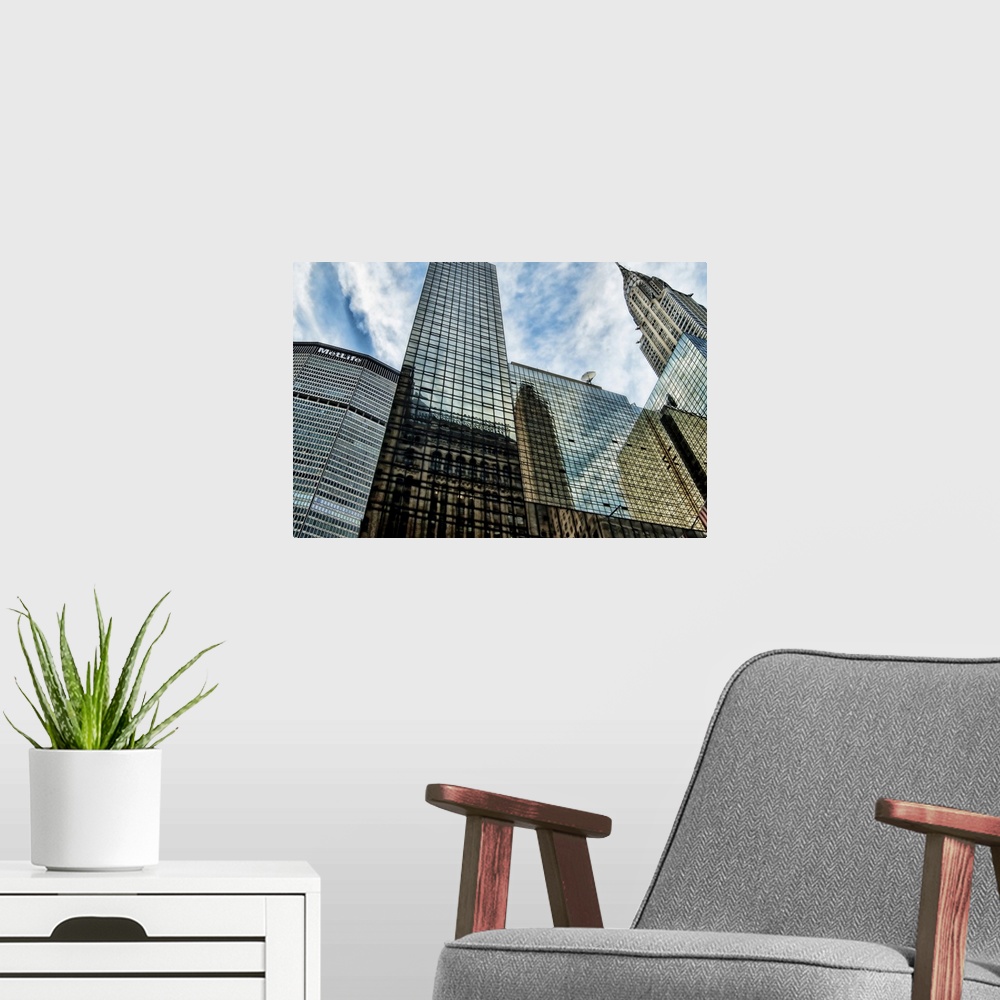 A modern room featuring HDR of Met Life and Chrysler Building, Manhattan, New York City. Low Angle.