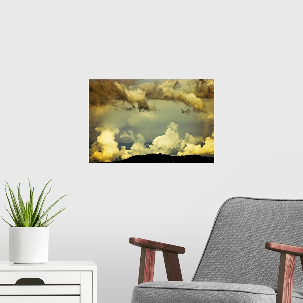 A modern room featuring Scattered monsoon clouds above hills