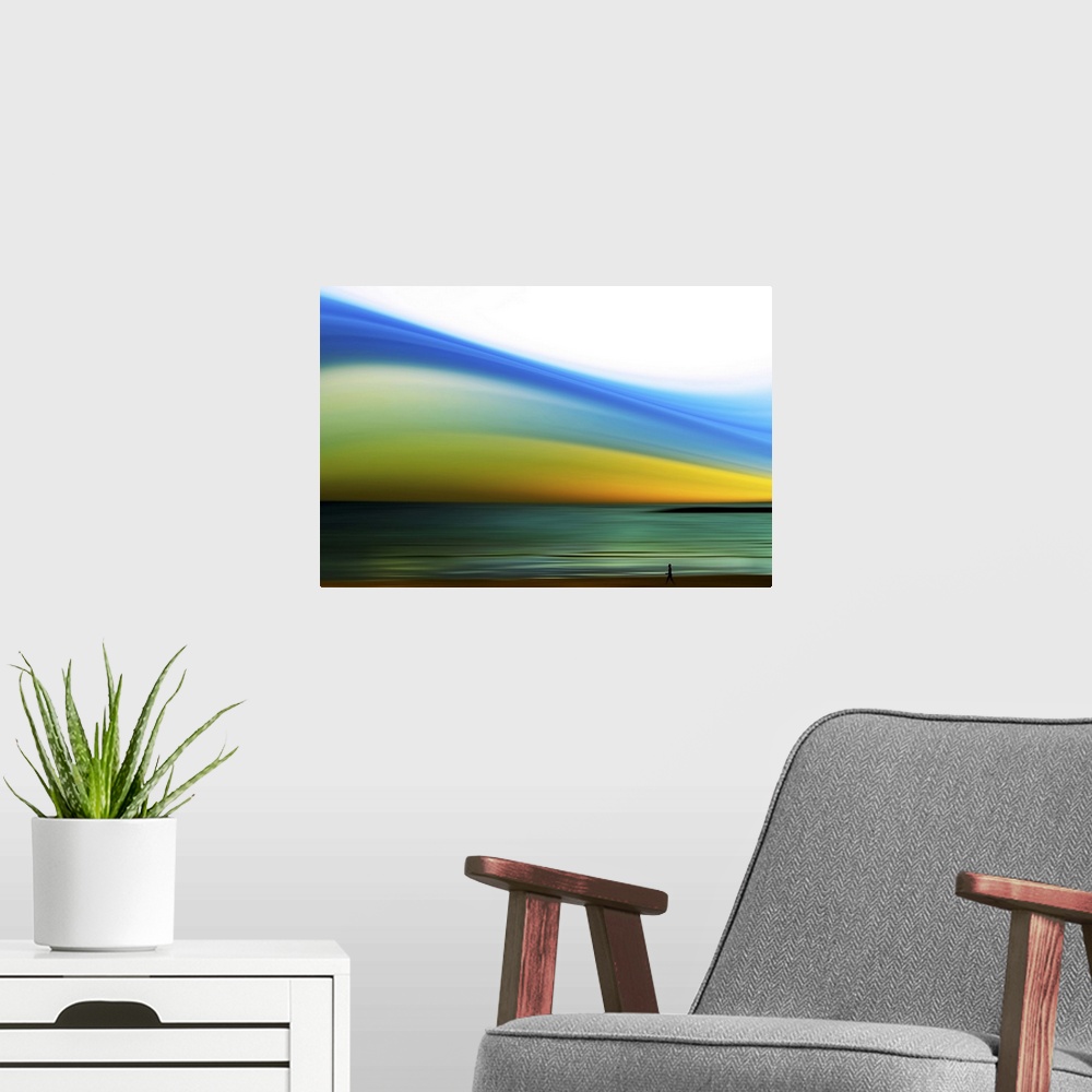 A modern room featuring Wall art of a person's silhouette walking on the shore of a beach with an abstractly colored sky.