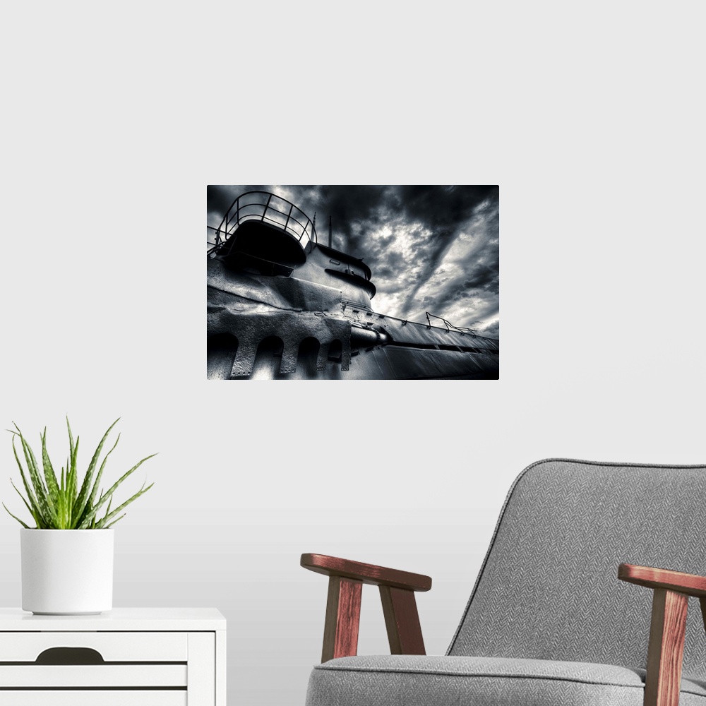 A modern room featuring German U-boat under clouds that resemble waves at sea.