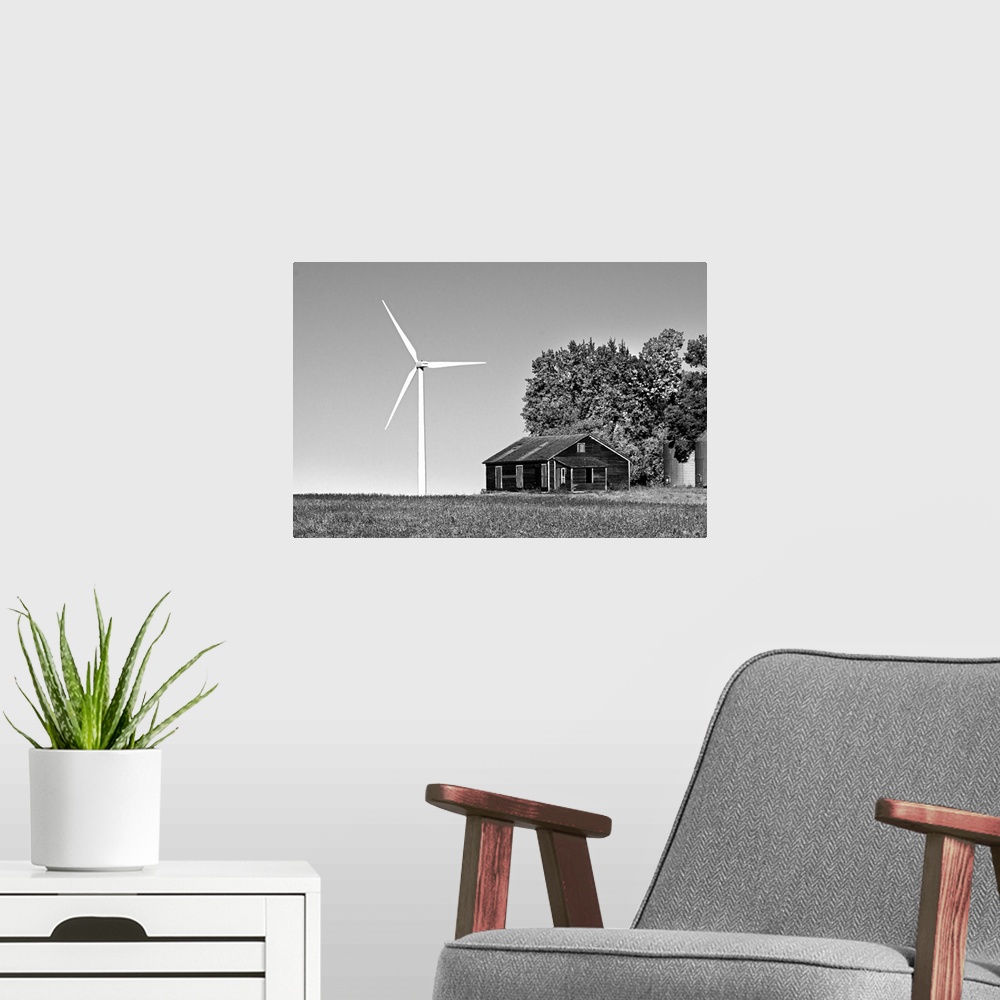 A modern room featuring Wind turbine in rural location with old barn in Cavalier County USA