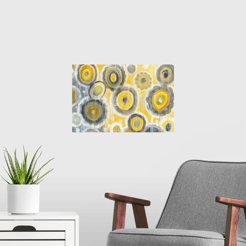 A modern room featuring Geometric abstract painting with yellow, gray, and white circles and white paint drips falling fr...