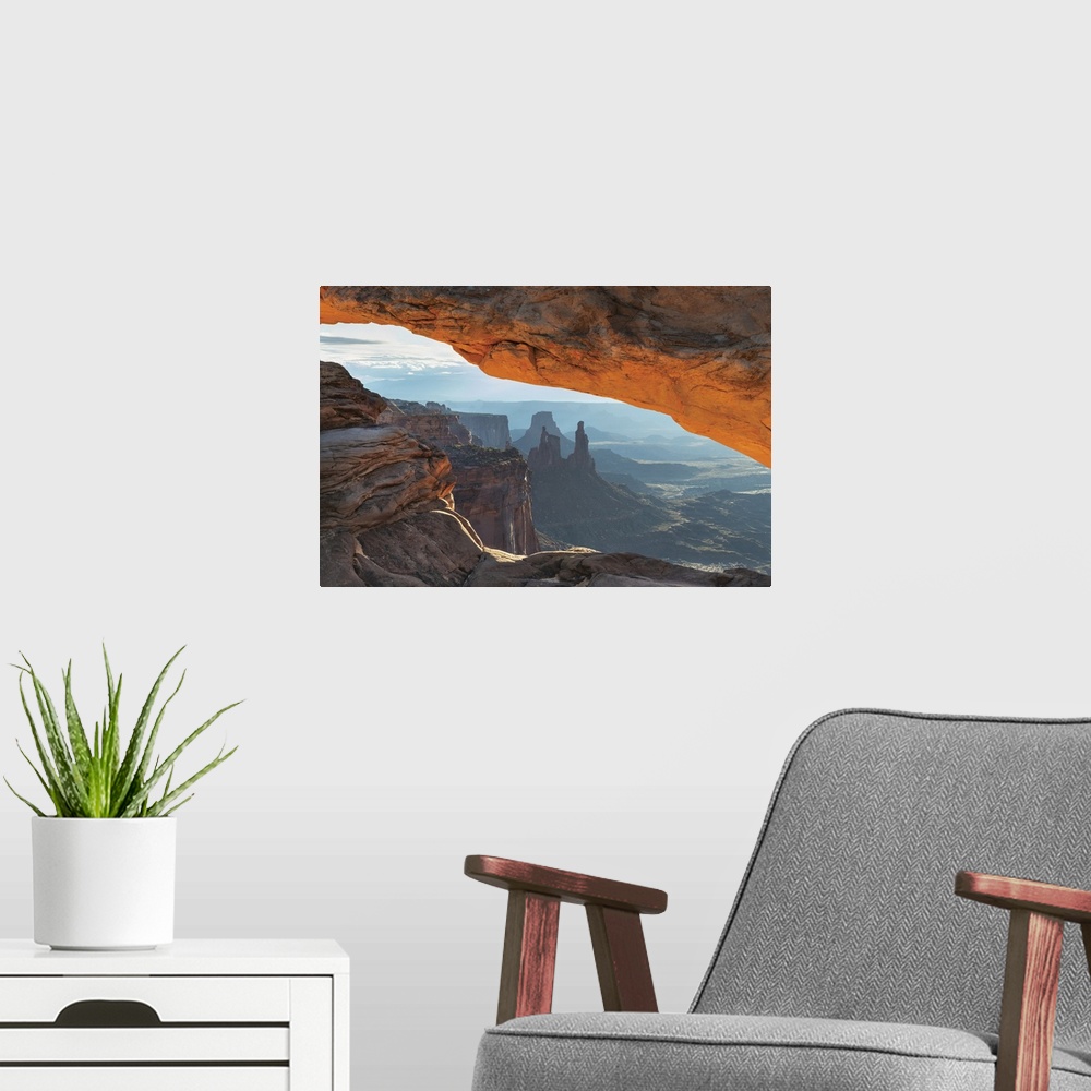 A modern room featuring Mesa Arch Canyonlands National Park Washer Woman Arch, Monster and Airport Towers are in the dist...