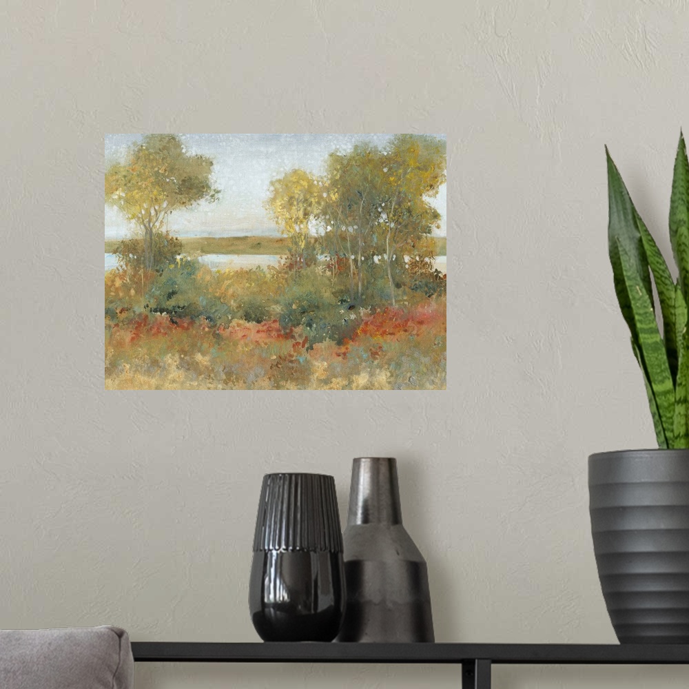A modern room featuring Contemporary painting of an idyllic countryside scene with trees and a river.