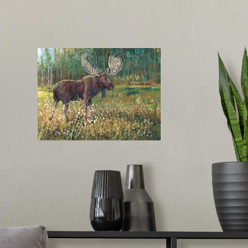 A modern room featuring Contemporary painting of a moose standing in a meadow near a forest.