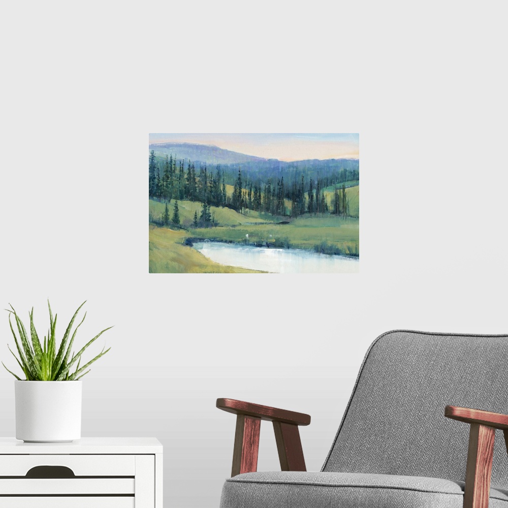 A modern room featuring Landscape painting of a tree lined meadow with a mountain range in the distance.