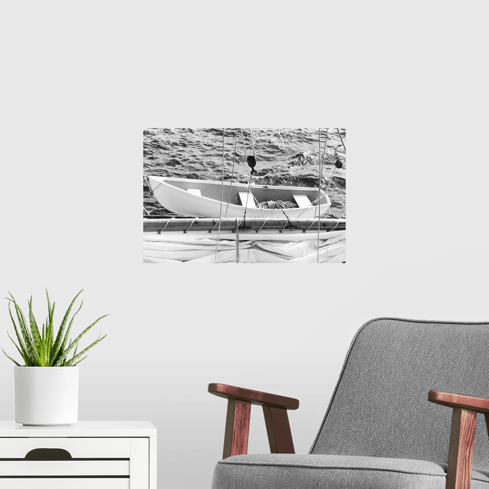 A modern room featuring Black and white photograph of a details on a sailboat.