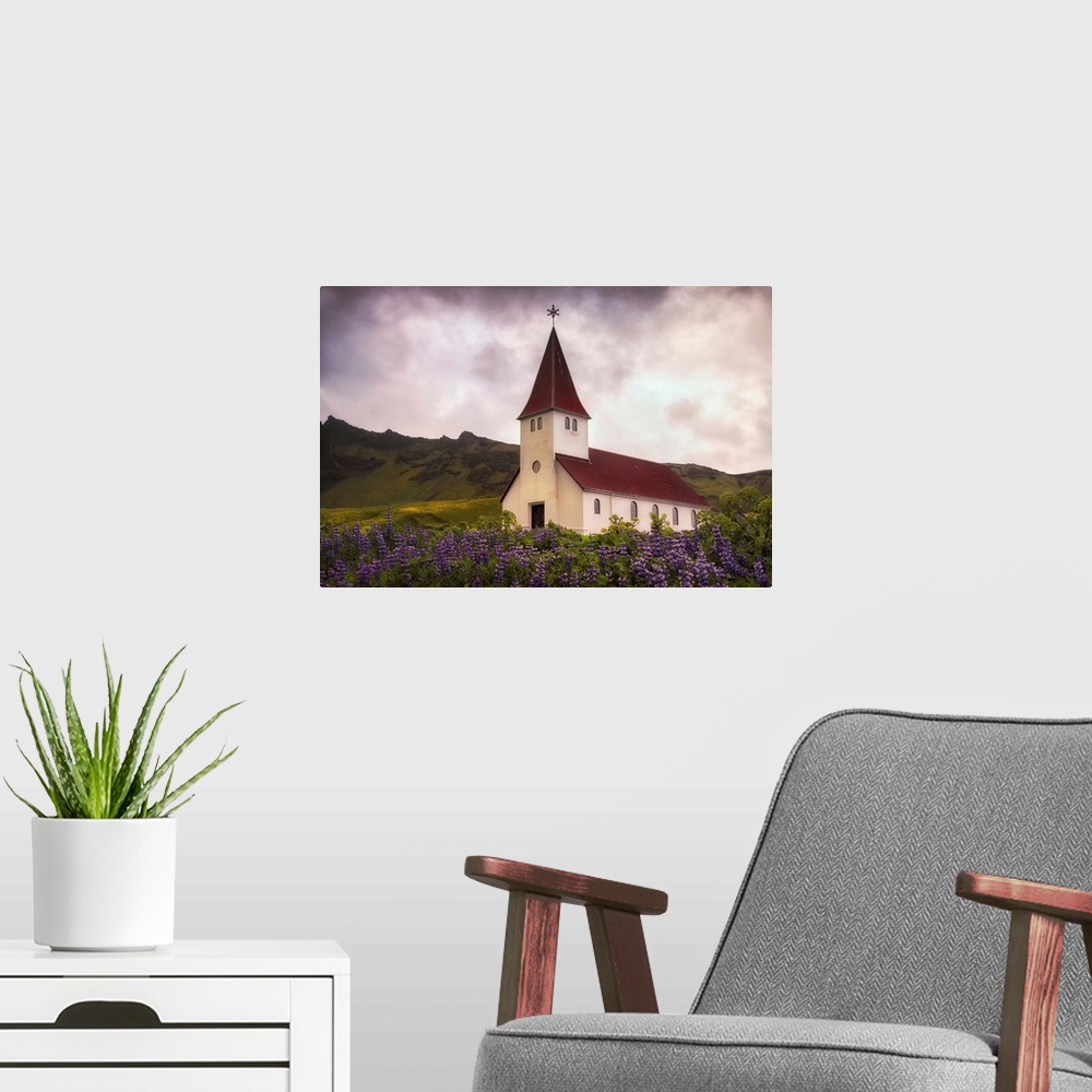 A modern room featuring In this photo, a storm begins to brew above a peaceful church near a field of lavender.