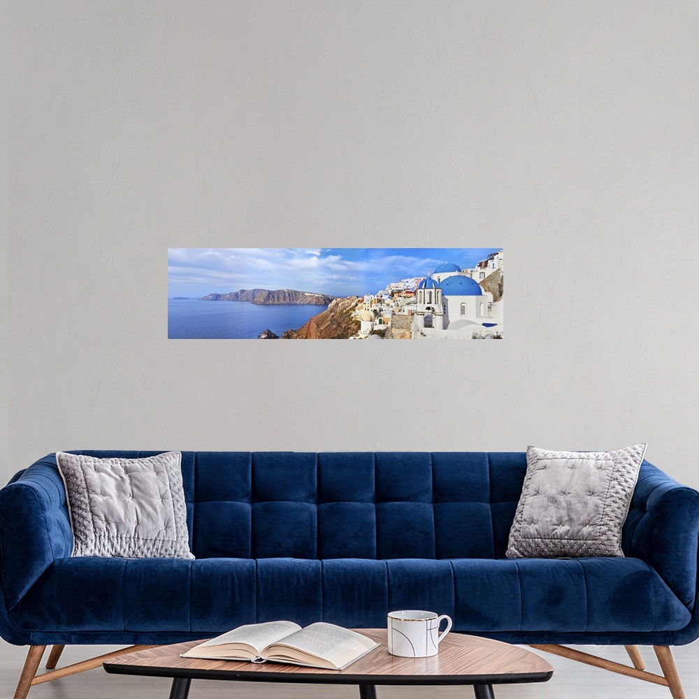 A modern room featuring Panoramic view of Oia village on Santorini island, Greece.