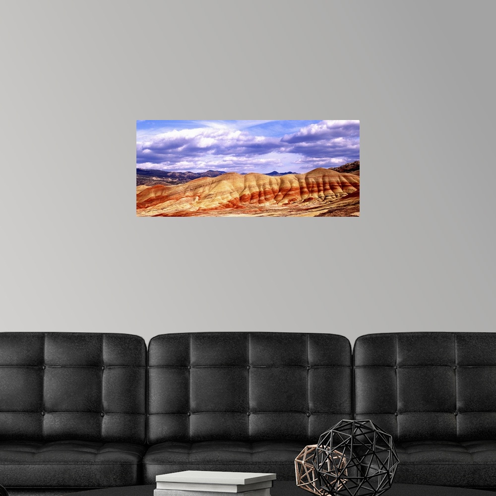 A modern room featuring Large white clouds over the Painted Hills in Oregon.