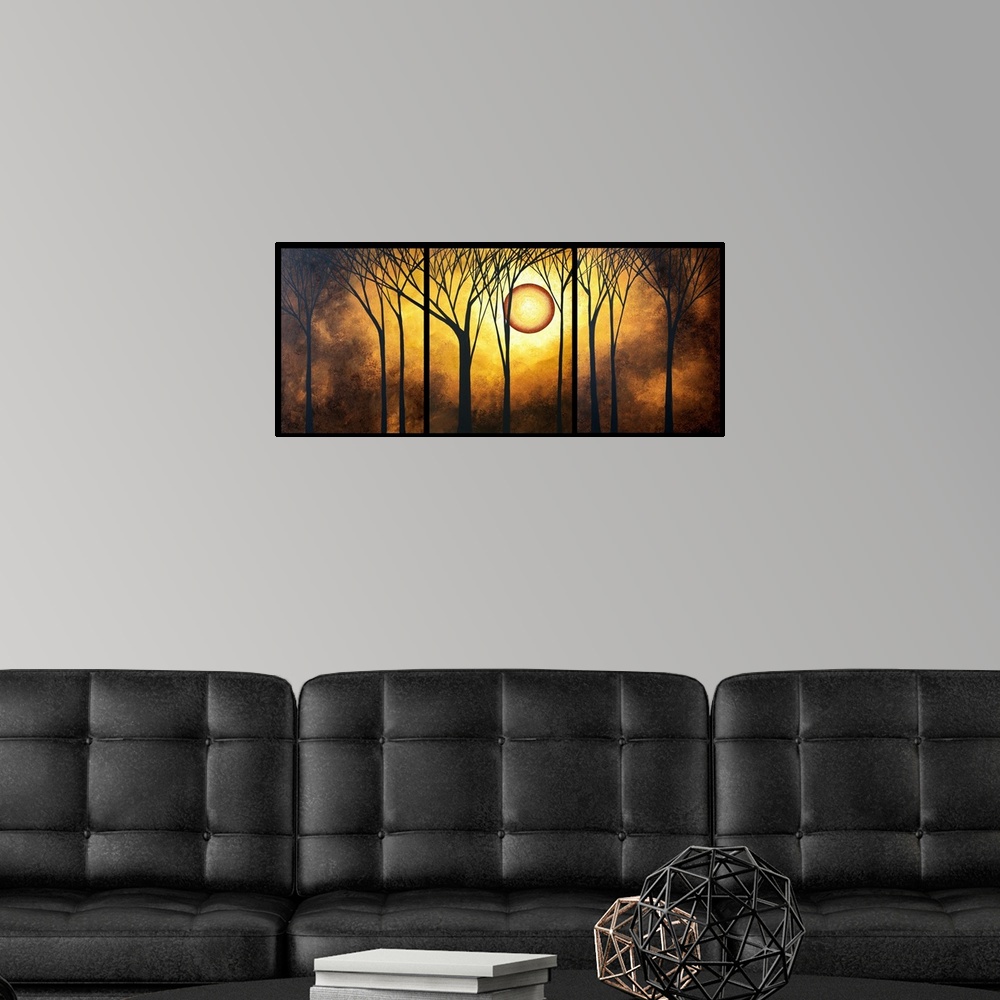 A modern room featuring A piece of contemporary artwork that has silhouettes of trees in front of a bright golden sun and...