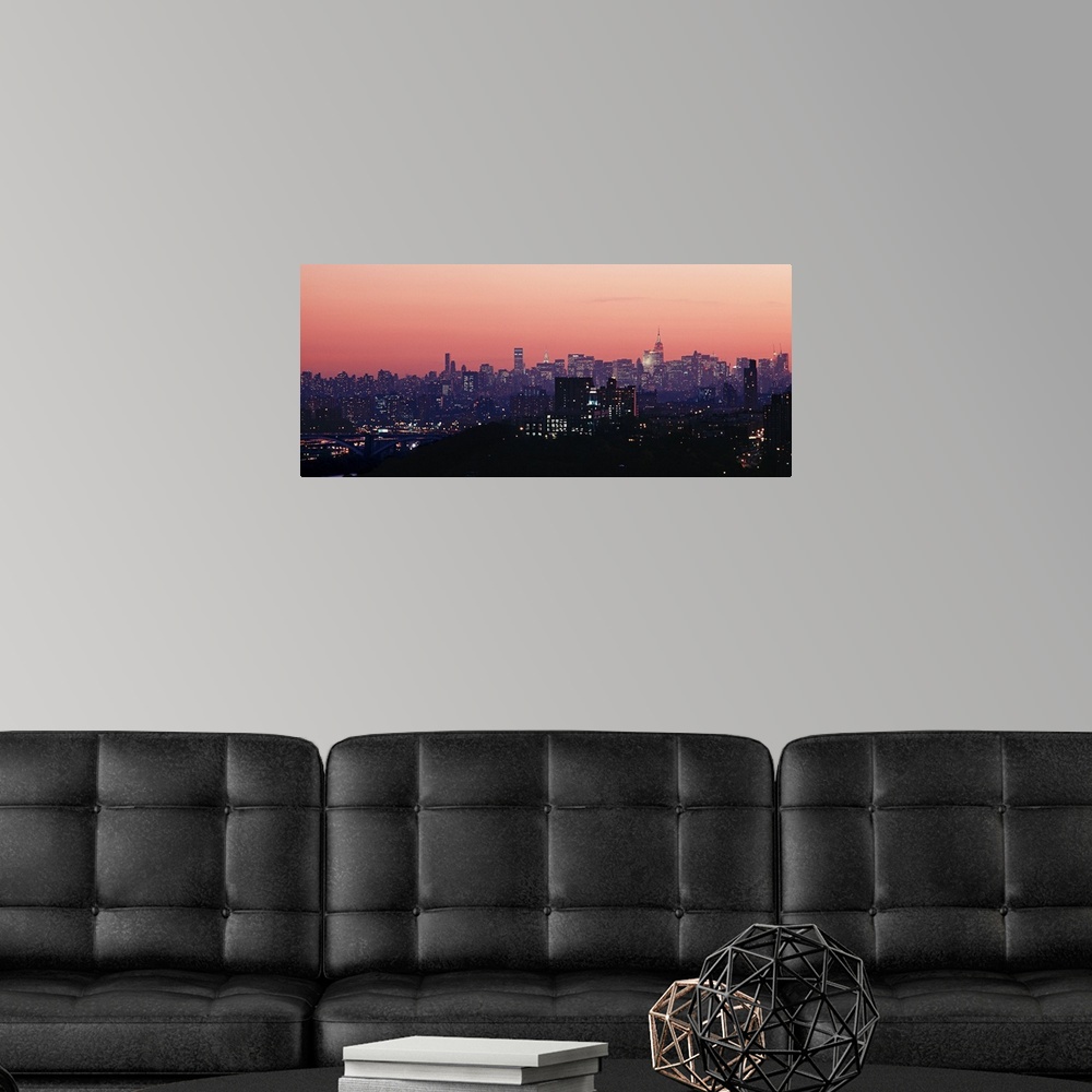 A modern room featuring High angle view of buildings lit up at dusk, Manhattan, New York City, New York State