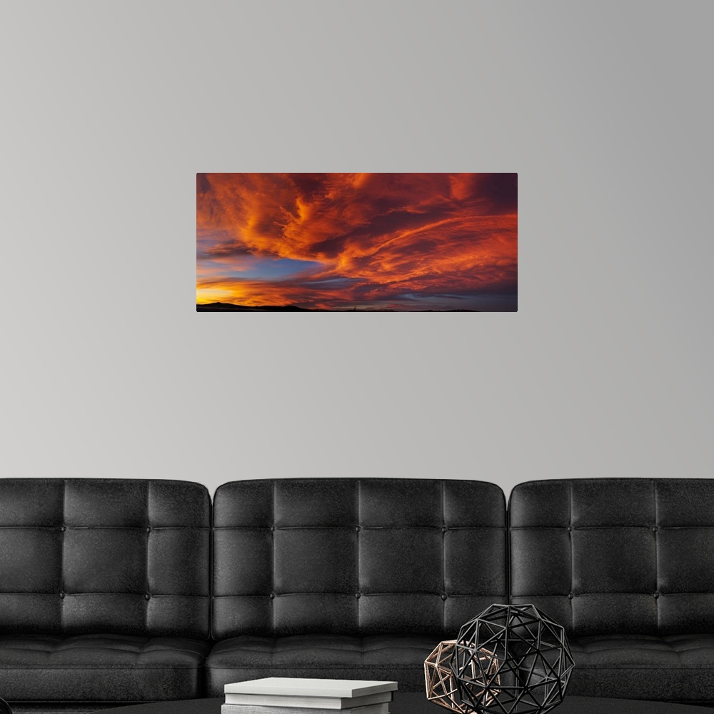 A modern room featuring Red dramatic sky during sunset, Taos, Taos County, New Mexico, USA.