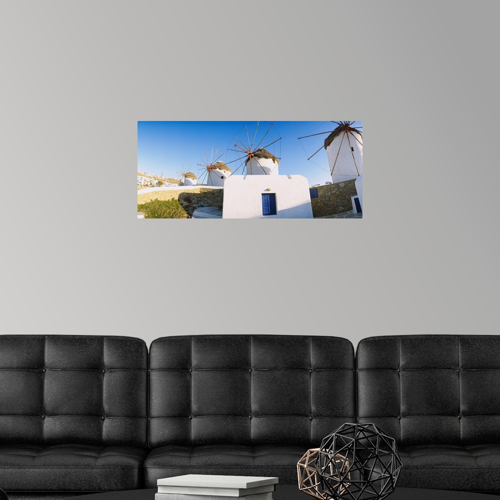A modern room featuring Traditional windmill in a village, Mykonos, Greece