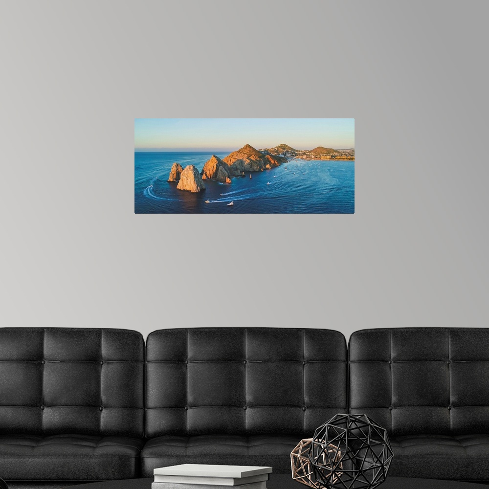 A modern room featuring The Cabo arch lights up at sunset.