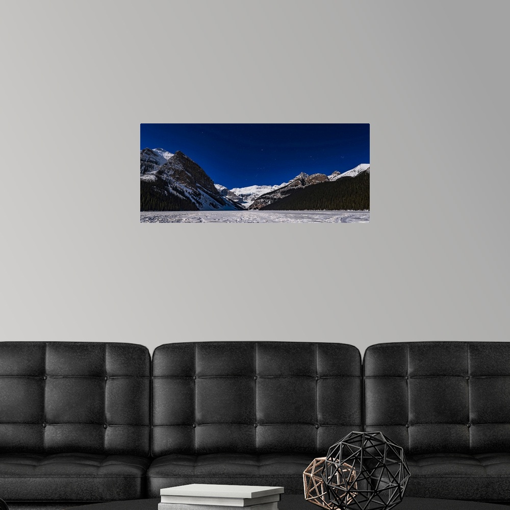 A modern room featuring Orion setting over the iconic Victoria Glacier at Lake Louise, frozen here in March, and with the...