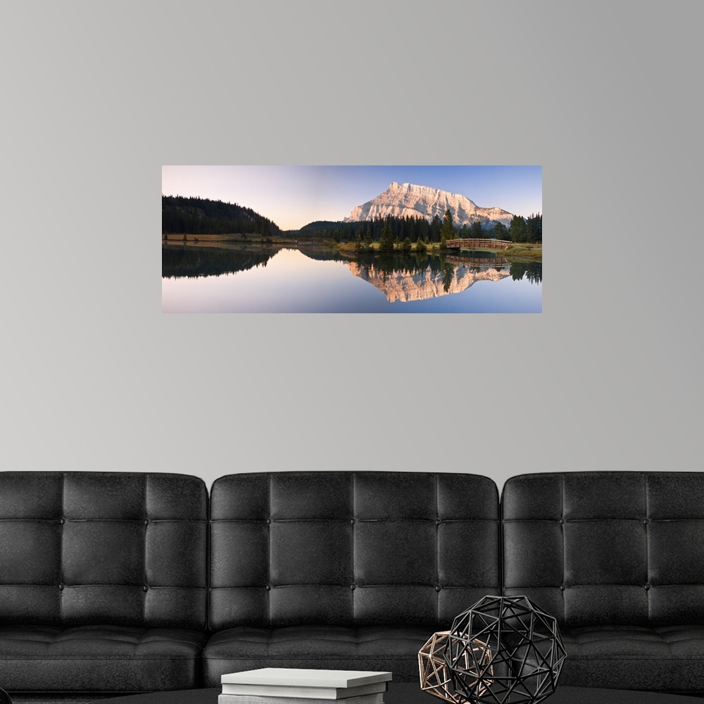 A modern room featuring A Scenic Shot Of A Mountainside And Small Bridge; Banff National Park, Alberta, Canada