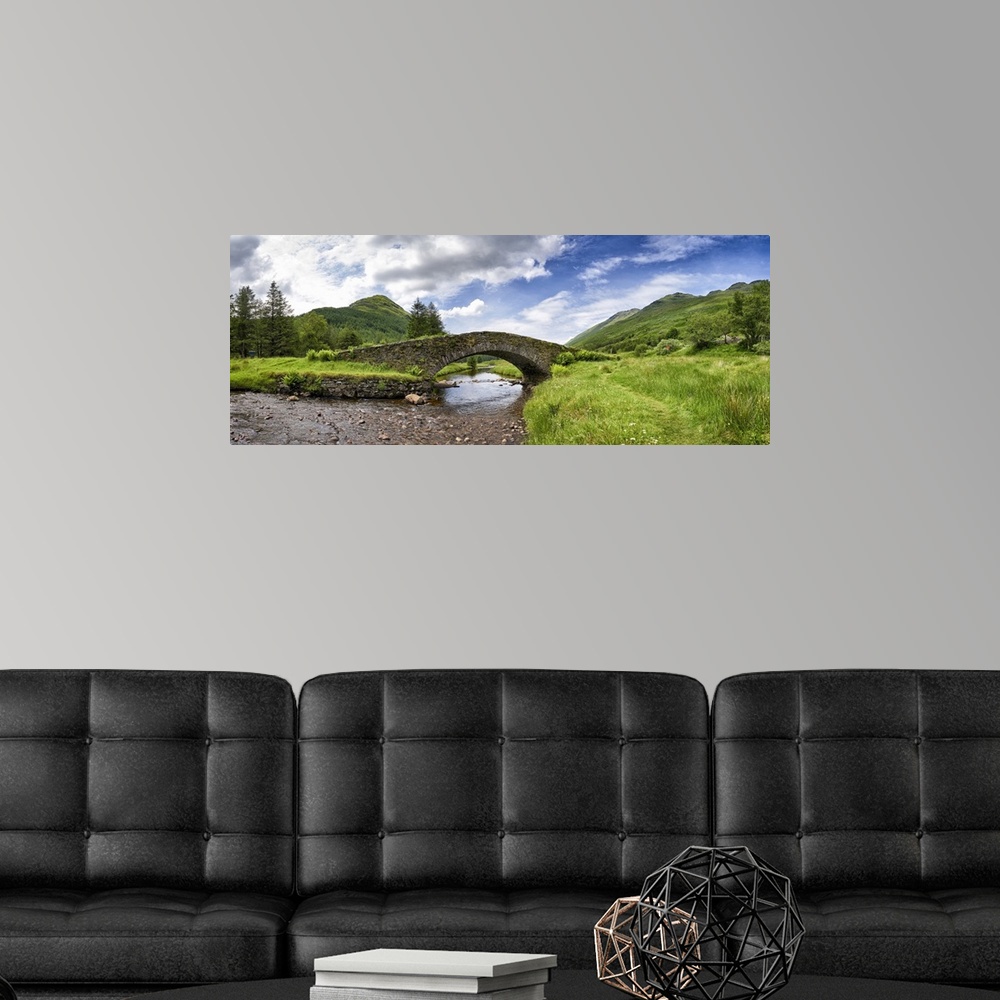 A modern room featuring Panoramic view of Butter Bridge over Kinglas Water in the Loch Lomond National Park in Scotland.