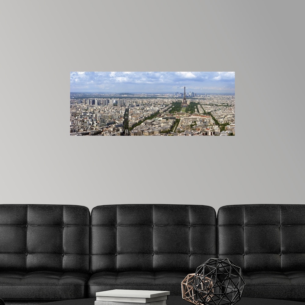 A modern room featuring Paris aerial panoramic view from Montparnasse tower over Champs de Mars and Eiffel tower.