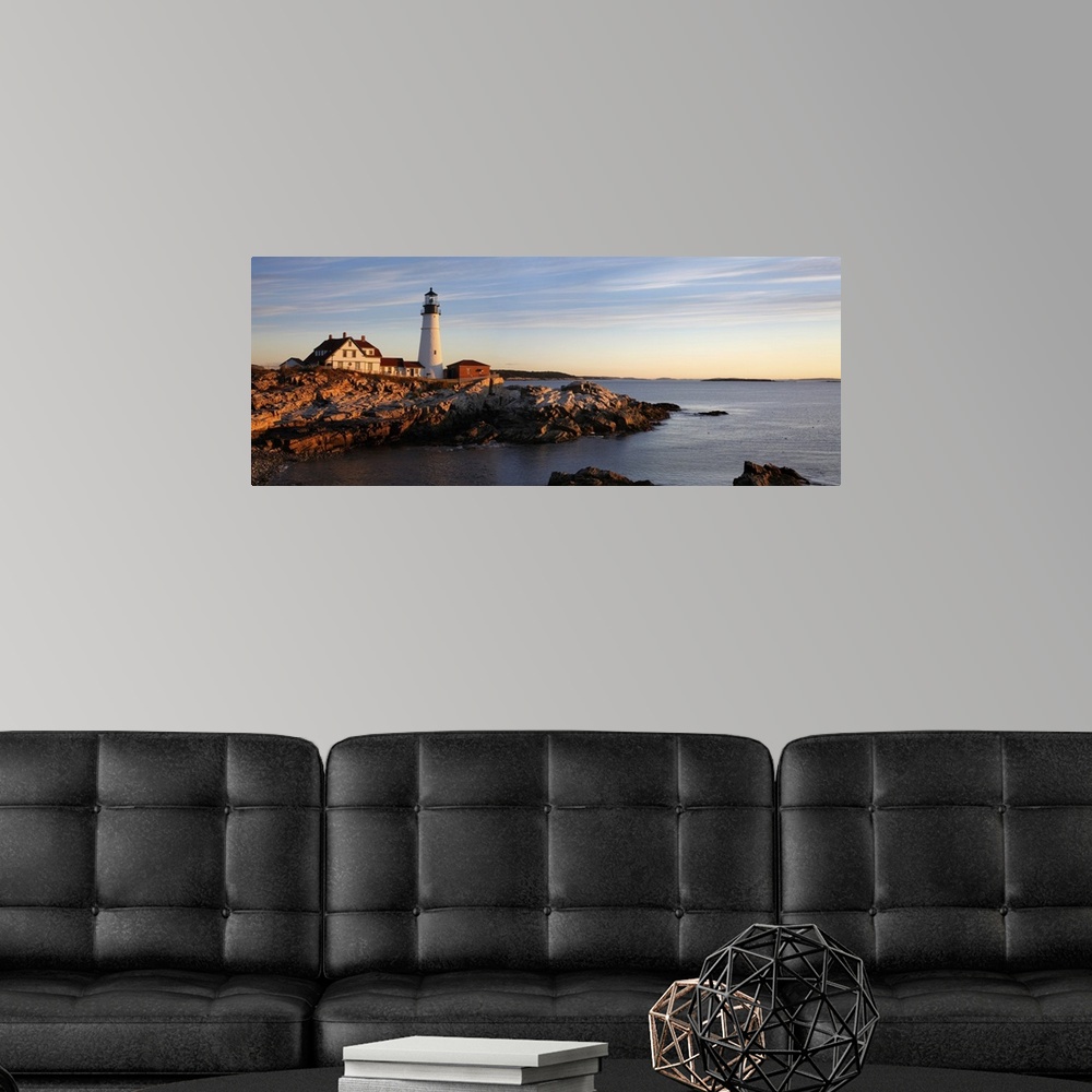 A modern room featuring The serene beauty of the Portland Head Light At Dawn, Portland Maine.
