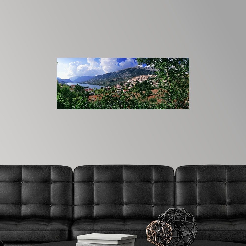A modern room featuring Italy, Abruzzo, Abruzzi, Abruzzo National Park, Barrea, View of town and lake