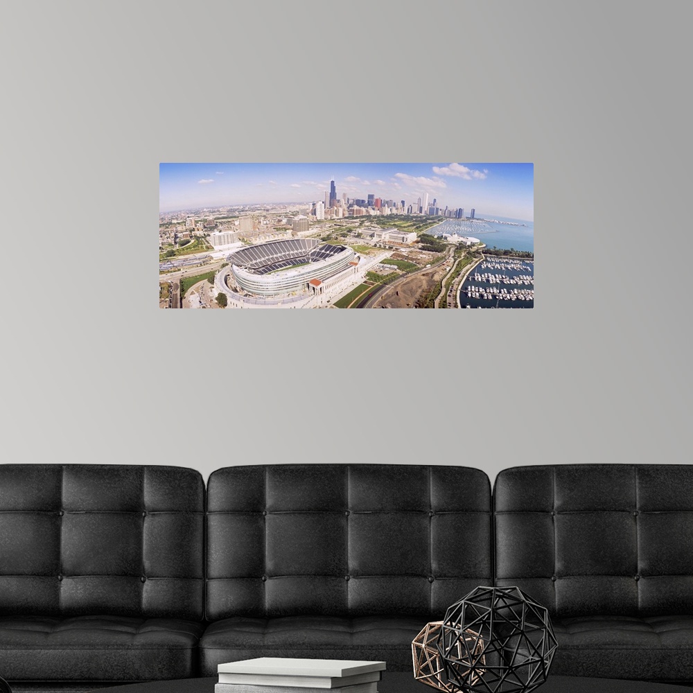 A modern room featuring Vista over the city of Chicago with a clear view of the football stadium, the city skyline, and t...