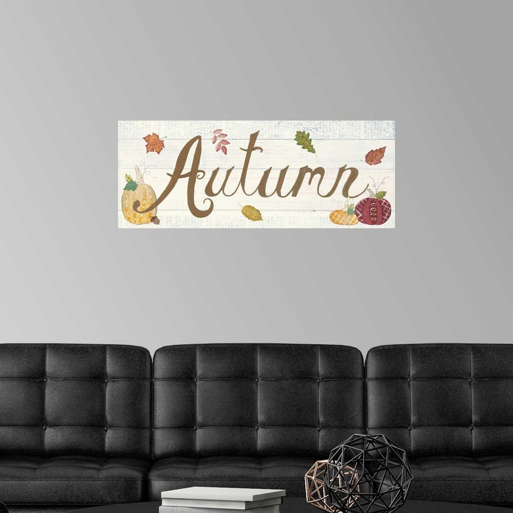 A modern room featuring Decorative artwork of the word "Autumn" with fall leaves and pumpkins and a white wood background.