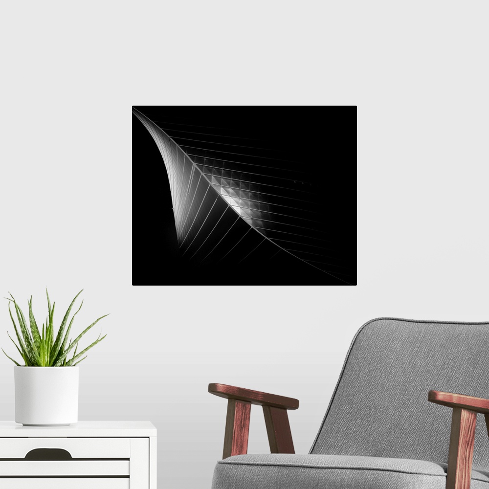 A modern room featuring Black and white architectural abstract photograph of the Kuwait Trading Center.